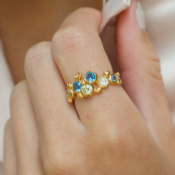 Small gold-plated sterling silver ring with blue and green cubic zirconia