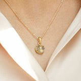 14 kt 'Conjure' gold necklace with cabochon-cut moonstone