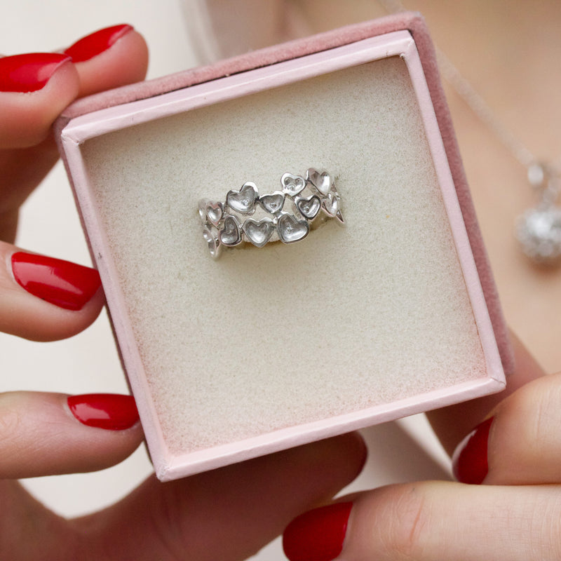 Sterling silver ring with hearts and cubic zirconia