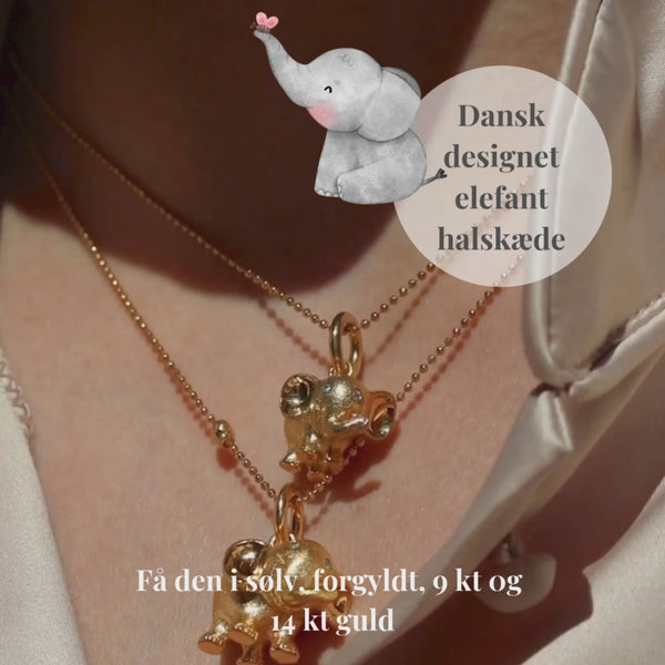 14 kt massiv guld elefant med diamantøjne