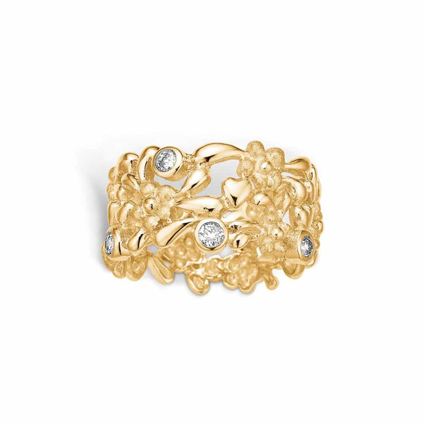 14 kt gold ring with matte diamond-studded flowers and 4 diamonds