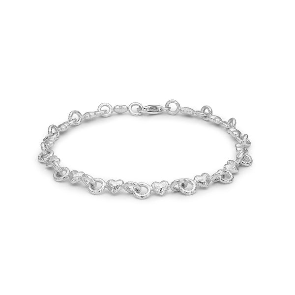 Solid sterling silver bracelet with small rustic hearts
