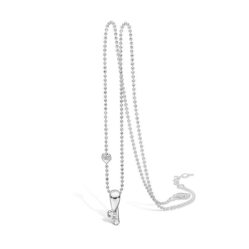 Sterling silver necklace with heart grabber and cubic zirconia between