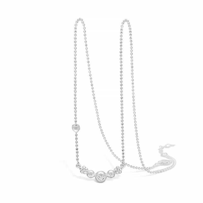 Sterling silver necklace with fixed pendant of flowers and cubic zirconia