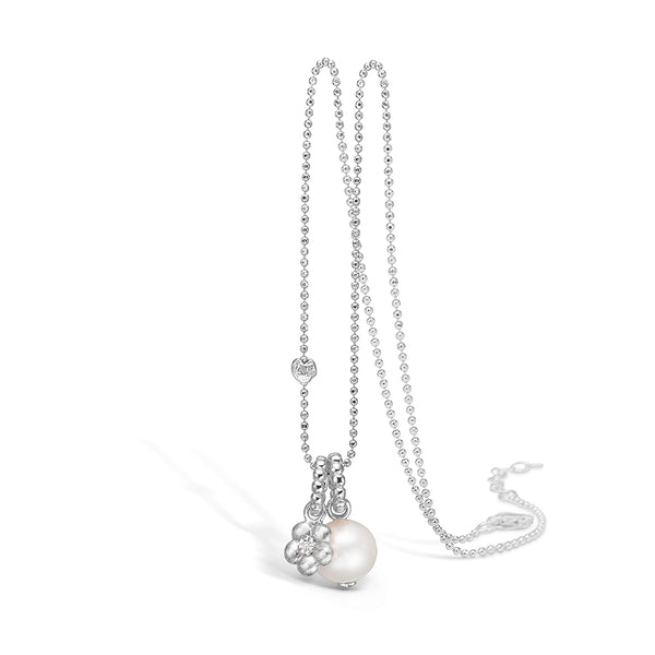 Sterling silver necklace with a freshwater pearl and flower with cubic zirconia