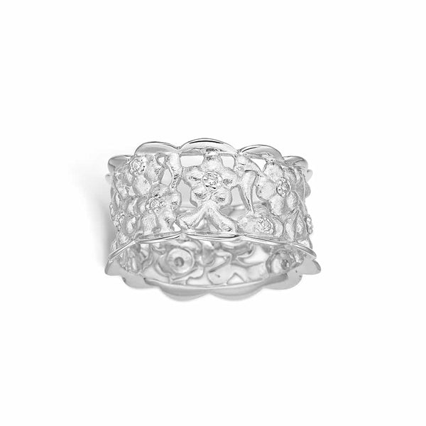 Sterling silver matte flower ring with shiny wavy edge and cubic zirconia