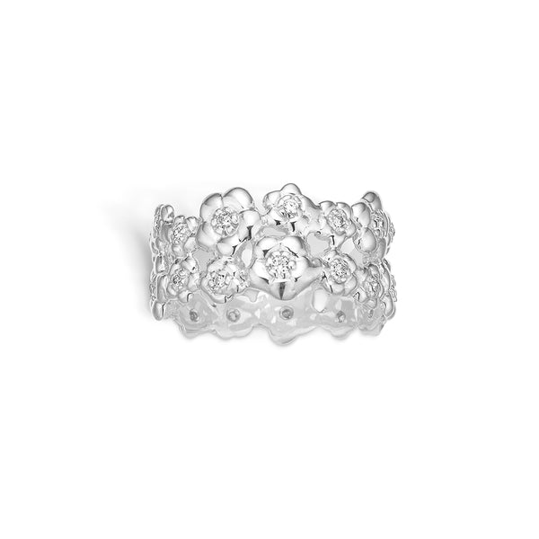 Sterling silver ring with shiny flowers and cubic zirconia