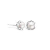 Sterling silver earrings with freshwater pearl surrounded by pattern
