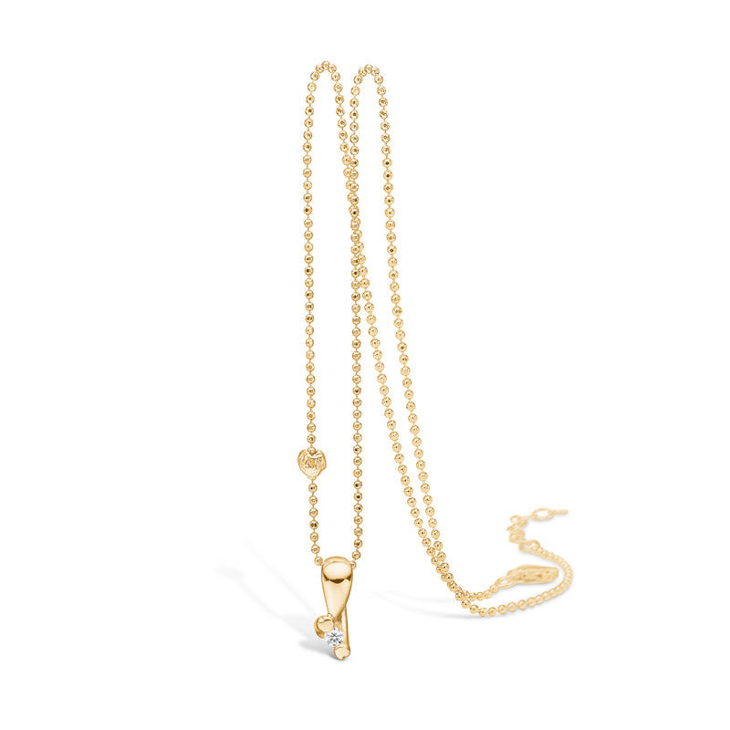 Gold-plated silver necklace with heart grabber and cubic zirconia between