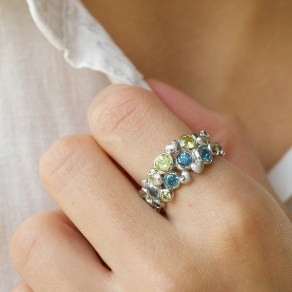 Rhodium-plated sterling silver ring with blue and green cubic zirconia