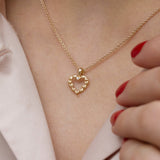 14 kt gold necklace with the finest hearts and diamond